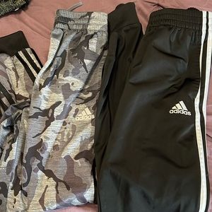 Two pairs of boys Adidas joggers
